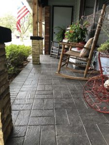 stamped concrete patio with rocking chairs
